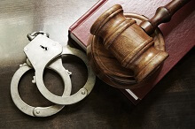 Handcuffs and a gavel for misdemeanor charges